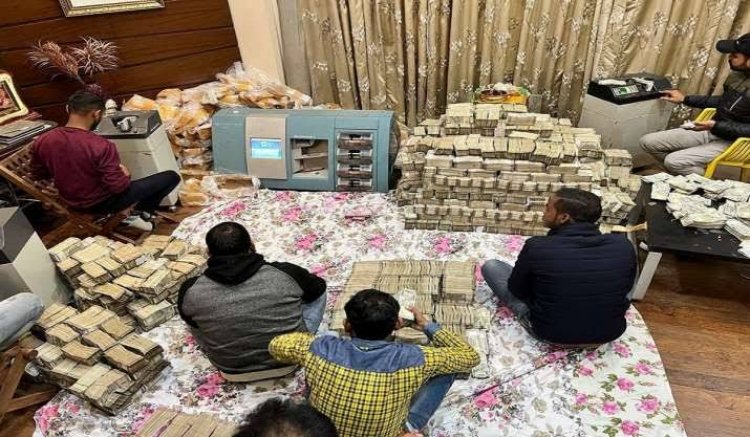 What do the confiscated property and money do when income tax evaders raid?
