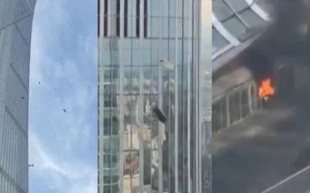 Car-sized aircraft crashes into Beijing's tallest building; police seal off the area.
